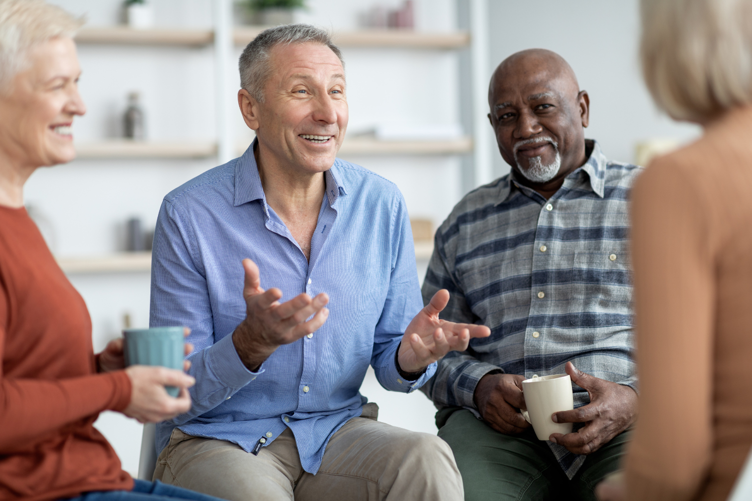 Older adults chatting together in a small group.